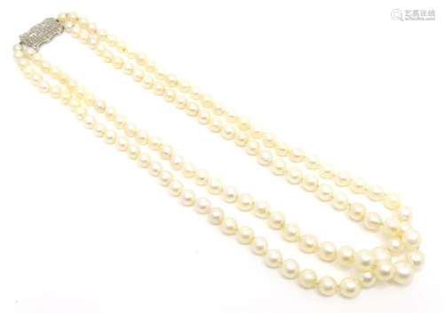 A two row pearl necklace of graduated pearls with 18ct white...