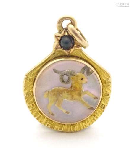 A late 19thC French gold pendant / lucky charm set with Esse...