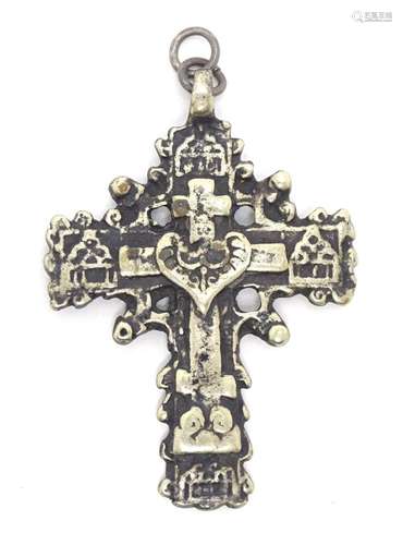 A white metal pendant of cross form. 2 1/4" long