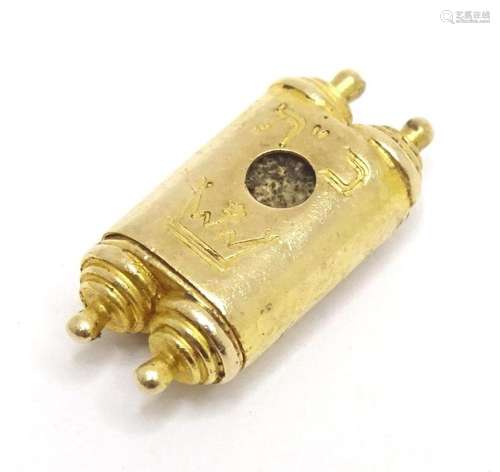 Judaica : A 9ct gold pendant formed as a Torah scroll. 3/4&q...