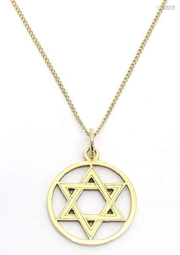 Judaica : A 9ct gold pendant with Star of David decoration 1...