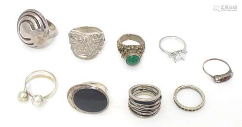 Eight assorted silver and white metal dress rings. Together ...