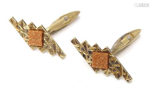 A pair of 'gold on silver' cufflinks, each set with ...