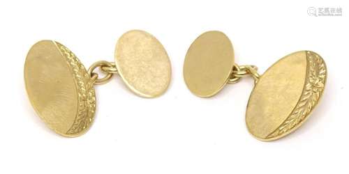 A pair of 9ct gold cufflinks with engraved decoration