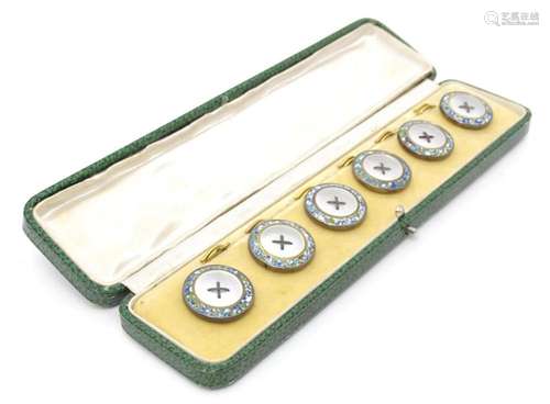 A cased set of six buttons with mother of pearl and enamel d...