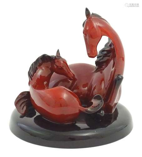 A Royal Doulton flambe model of horses on a circular base, T...