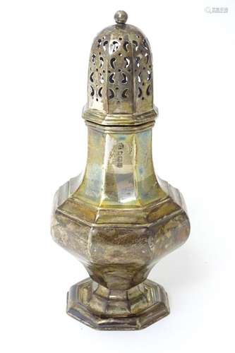 A silver sugar caster of octagonal baluster form, hallmarked...