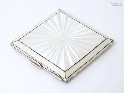 An Art Deco silver compact with guilloche enamel decoration ...