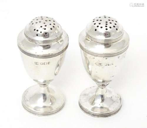 A pair of Victorian silver pepperettes, hallmarked Sheffield...