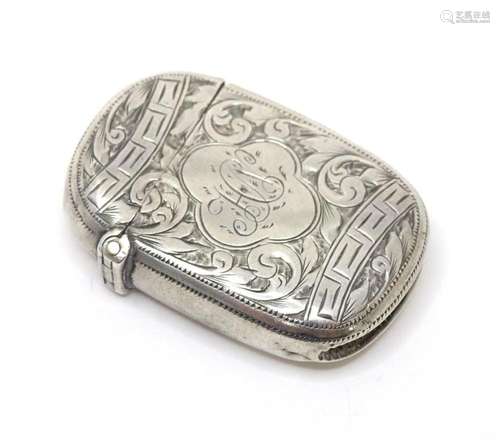 A Victorian silver vesta case with engraved foliate decorati...