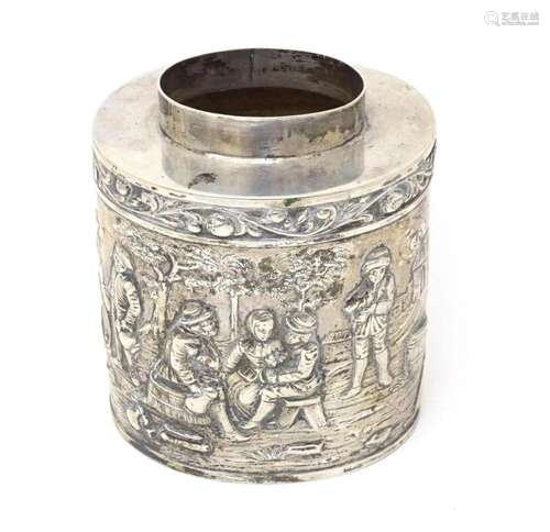 A Continental silver caddy with embossed decoration depictin...