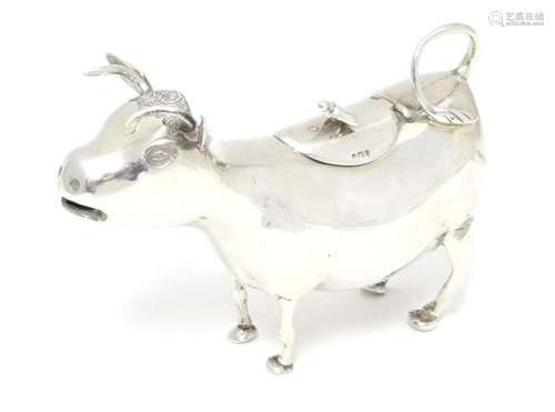 A 19thC Continental silver cow creamer with import marks for...