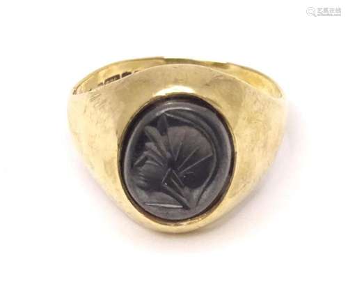 A 9ct gold ring set with intaglio. Ring size approx. O