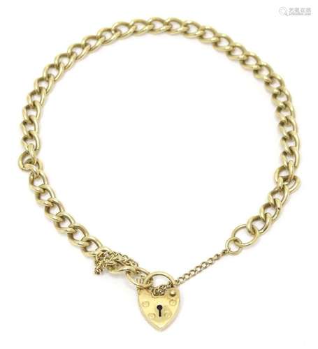 A 9ct gold bracelet with padlock style clasp. Approx. 7 1/2&...