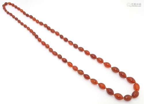 A bead necklace of graduated carnelian hardstone beads. Appr...