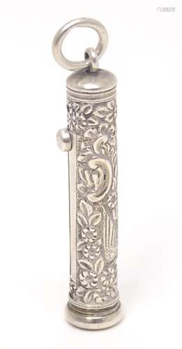 A white metal pencil slide with engraved decoration, by Albe...