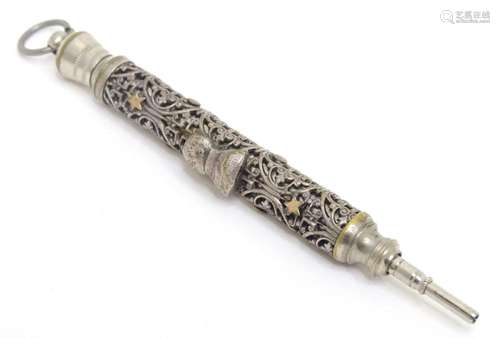 A silver plate propelling pencil with filigree style decorat...