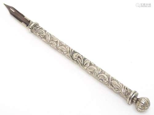 A 19thC white metal dipping pen with acanthus decoration sur...