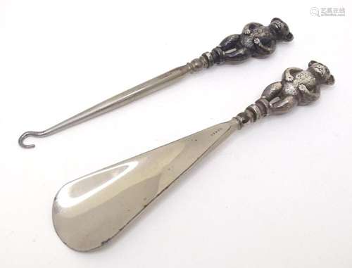 A shoe horn and button hook each with novelty silver handle ...