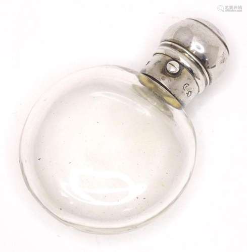 A glass perfume / scent bottle with white metal top. Approx....