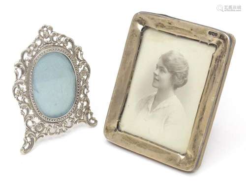 Two photographs frames with silver surrounds, one hallmarked...