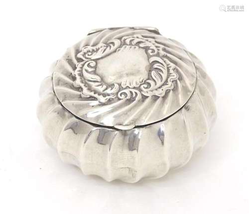 A Victorian silver pill box of circular form with fluted det...