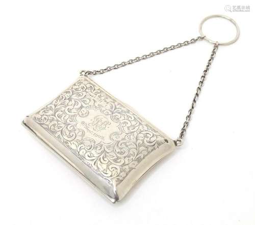 A silver purse with engraved acanthus scroll decoration, hal...