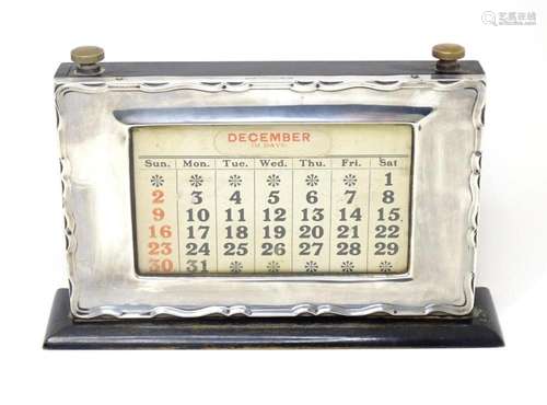 A desk calendar with silver surround hallmarked Birmingham 1...