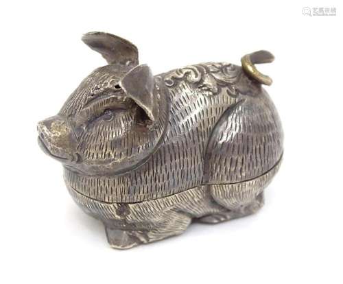 A white metal pot and cover modelled as a stylised pig, poss...