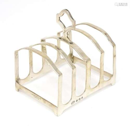 A silver five bar toast rack hallmarked 1926, maker Alexande...