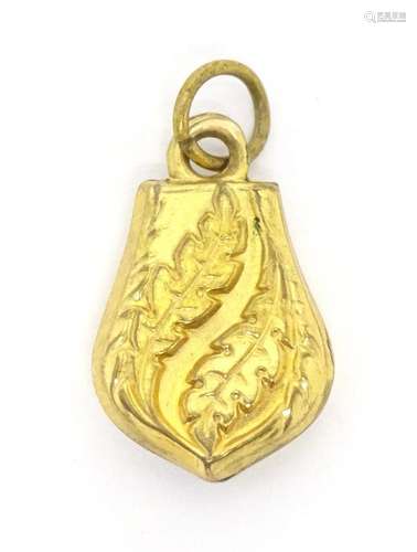 A pinchbeck pendant fob charm with foliate detail. Approx 3/...