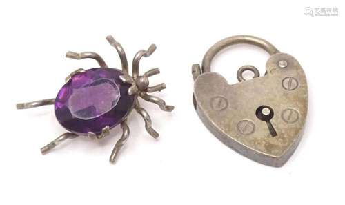 A white metal spider pendant set with amethyst. Together wit...