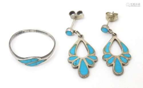 A silver ring set with turquoise detail, together with drop ...