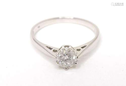 An 18ct white gold diamond solitaire ring. ring size approx ...