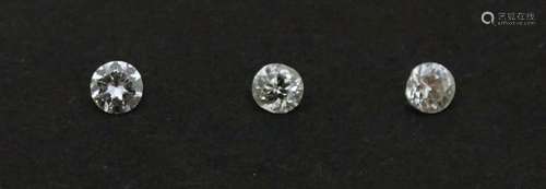 Loose unset stones: Three round cut diamonds. Largest approx...