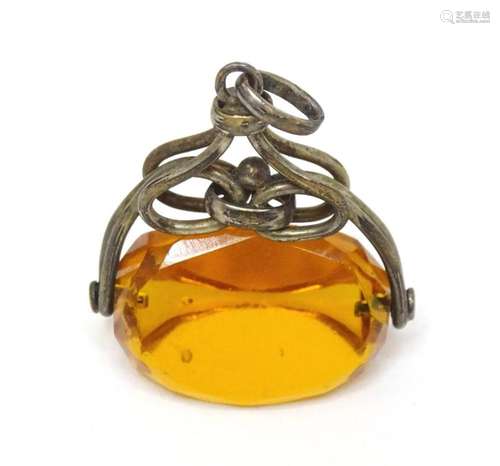 A pedant fob seal set with rotating citrine coloured seal to...