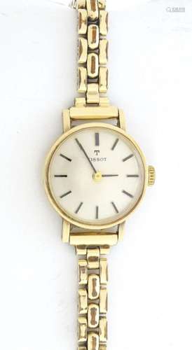 A 9ct gold ladies Tissot wrist watch. Approx 3/4" wide