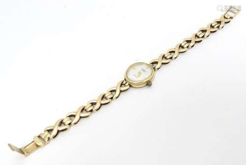 A 9ct gold Rotary Elite ladies wristwatch with 9ct gold stra...