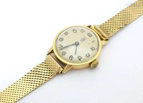 A French 18ct gold cased wristwatch with Arabic numerals wit...