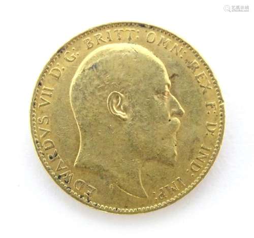 Coin : A George VII 1909 gold sovereign coin. Total weight a...