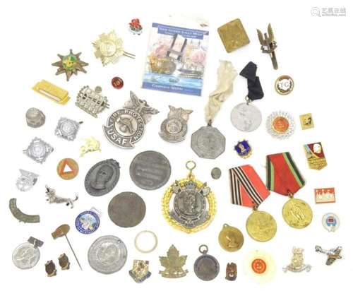 Militaria: a quantity of badges, medallions and medals, incl...