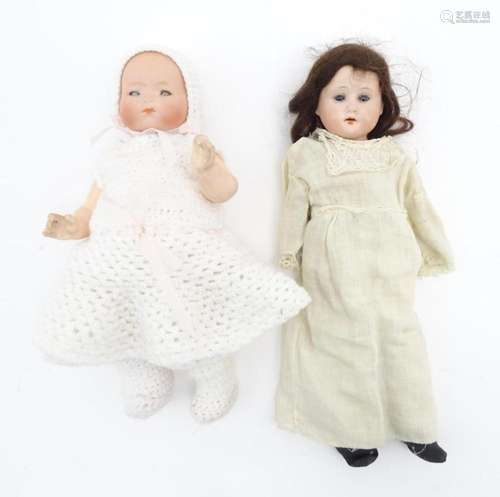 Toys: A 20thC Armand Marseille baby doll with a bisque head,...