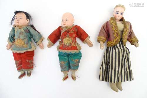 Toys: Two Chinese dolls with papier mache heads and hands, w...