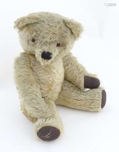 A 20thC mohair teddy bear with moving mouth mechanism, stitc...