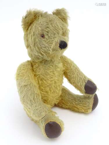 Toy: A 20thC mohair teddy bear with clockwork musical mechan...