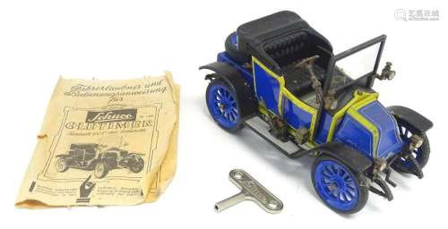 Toy: A West German Schuco tin plate clockwork car, Oldtimer ...