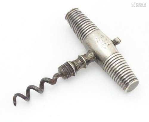 A 19thC corkscrew with white metal handle. Approx 2 3/4"...