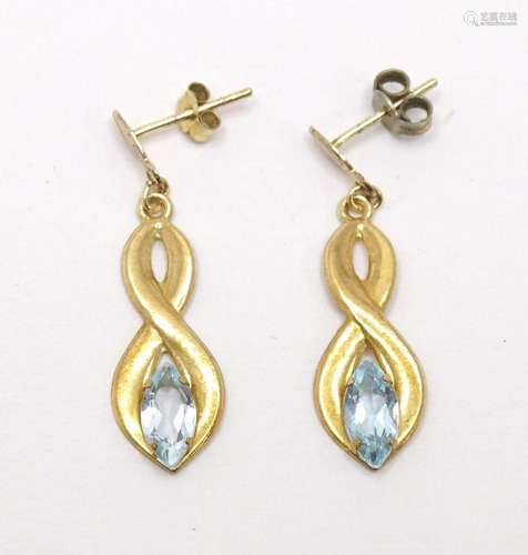 A pair of 9ct gold drop earrings set with topaz coloured sto...