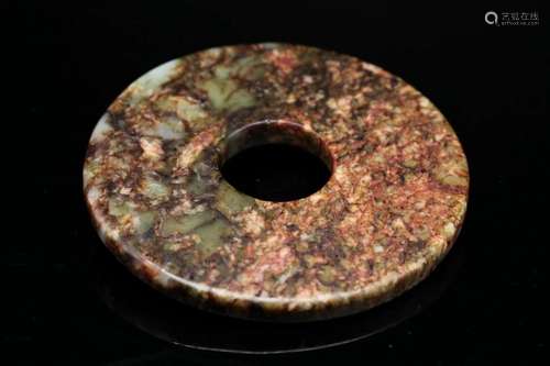 A Green Jade Bi Disc, Neolithic Period (Bonhams London)