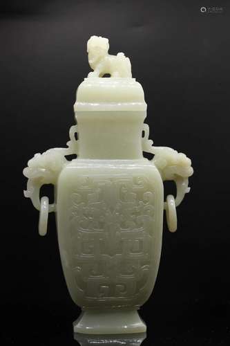 A pale Celadon Jade Archaistic Vase and Cover, Late Qing Dyn...